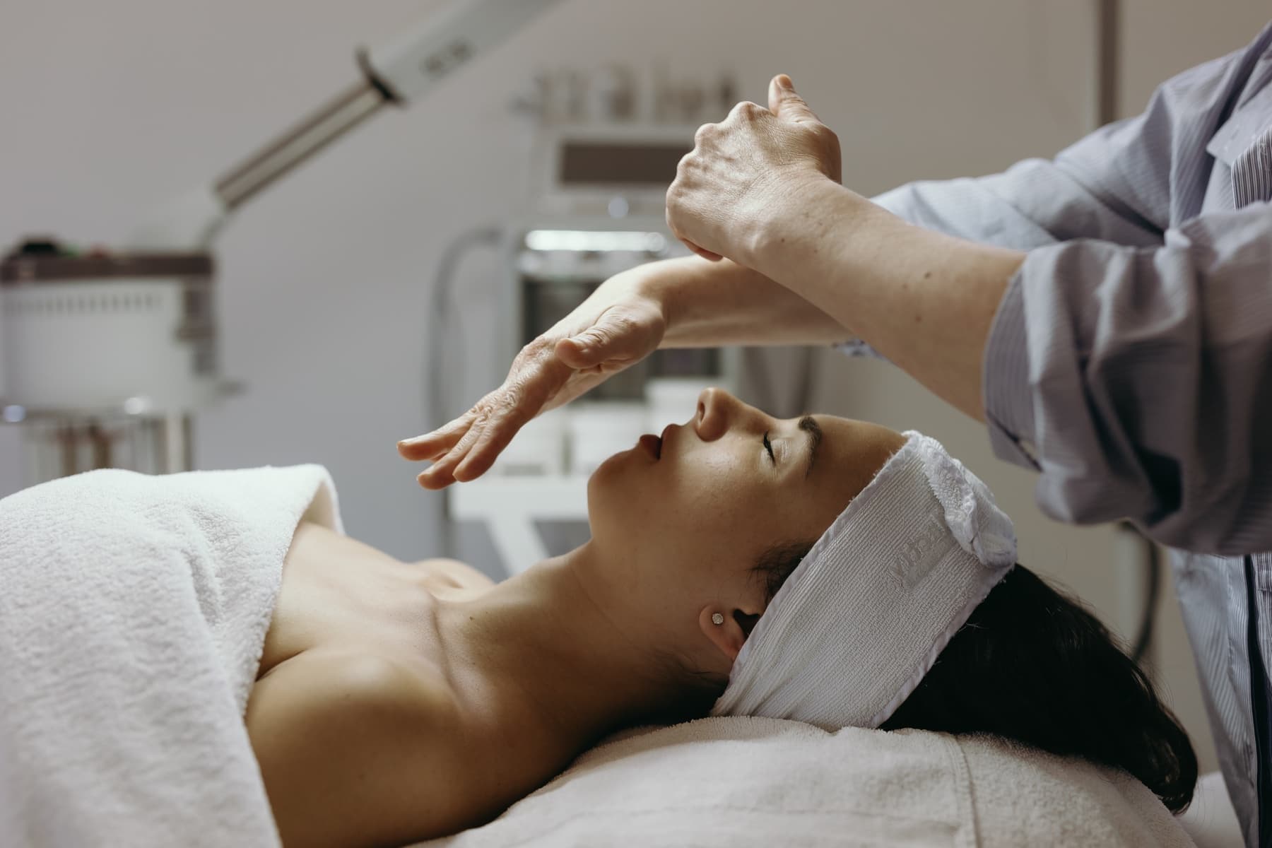 Natasha performing a facial treatment at All About Skin